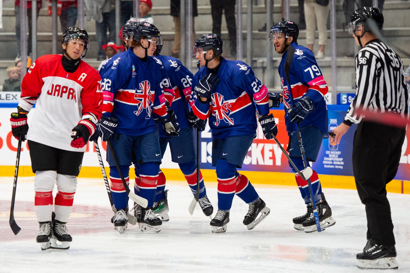 Great Britain celebrate their first goal against Japan