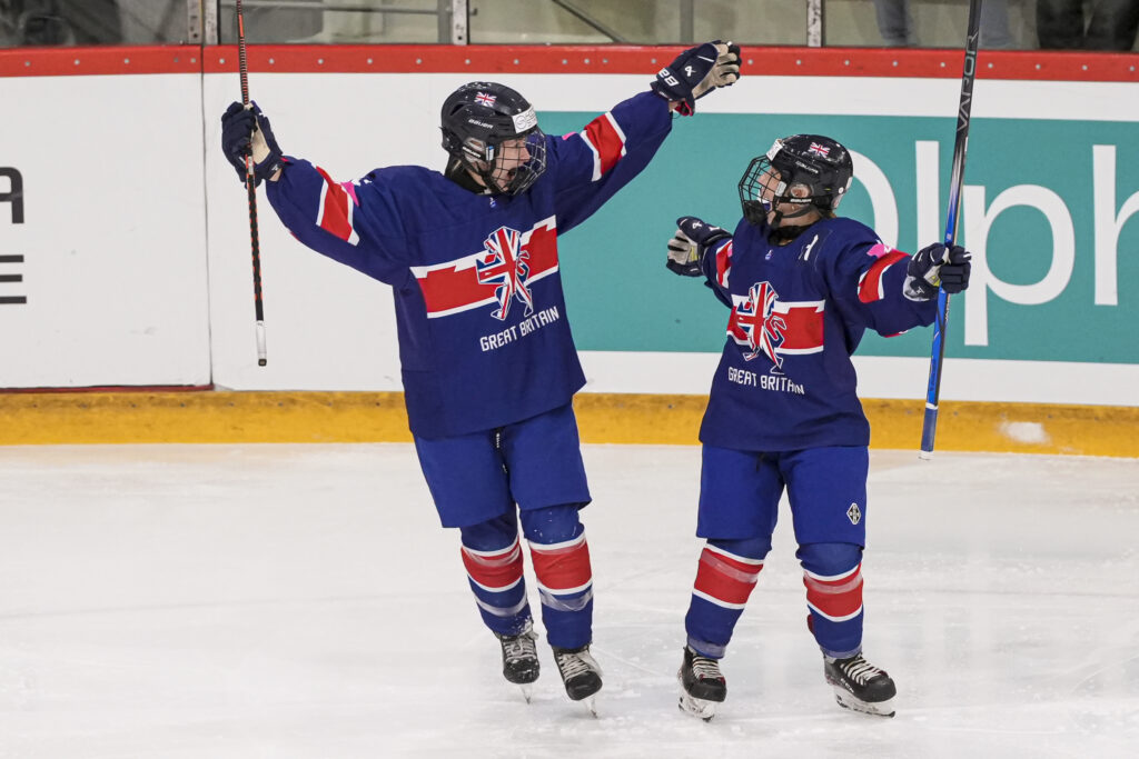 Great Britain celebrate scoring against New Zealand in the Under-18 Women's World Championship Division II Group A