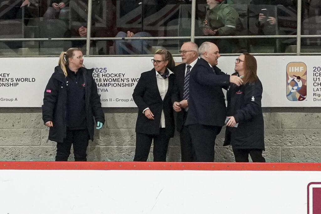 Great Britain's coaching staff celebrate gold at the U18 Women's World Championship Division II Group A